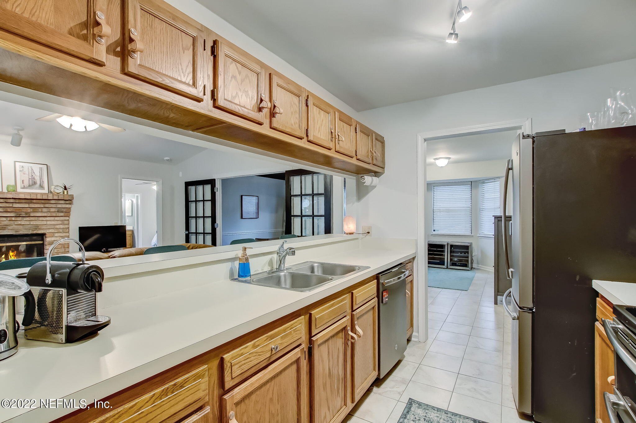 1618 Panther Ridge Court Jacksonville, FL 32225 - Photo 18 of 46 a kitchen with stainless steel appliances granite countertop a sink and a refrigerator