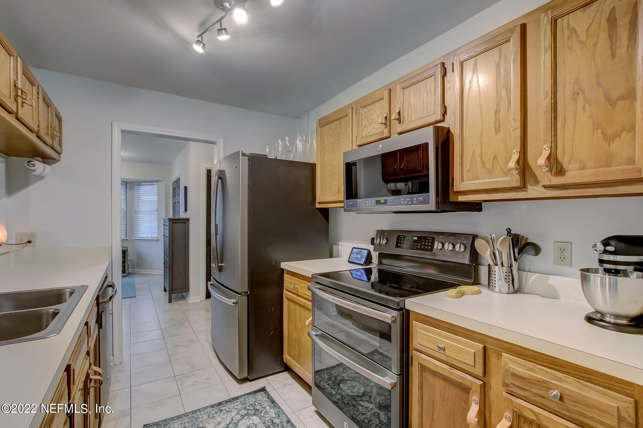 1618 Panther Ridge Court Jacksonville, FL 32225 - Photo 19 of 46 a kitchen with stainless steel appliances granite countertop a refrigerator stove and sink