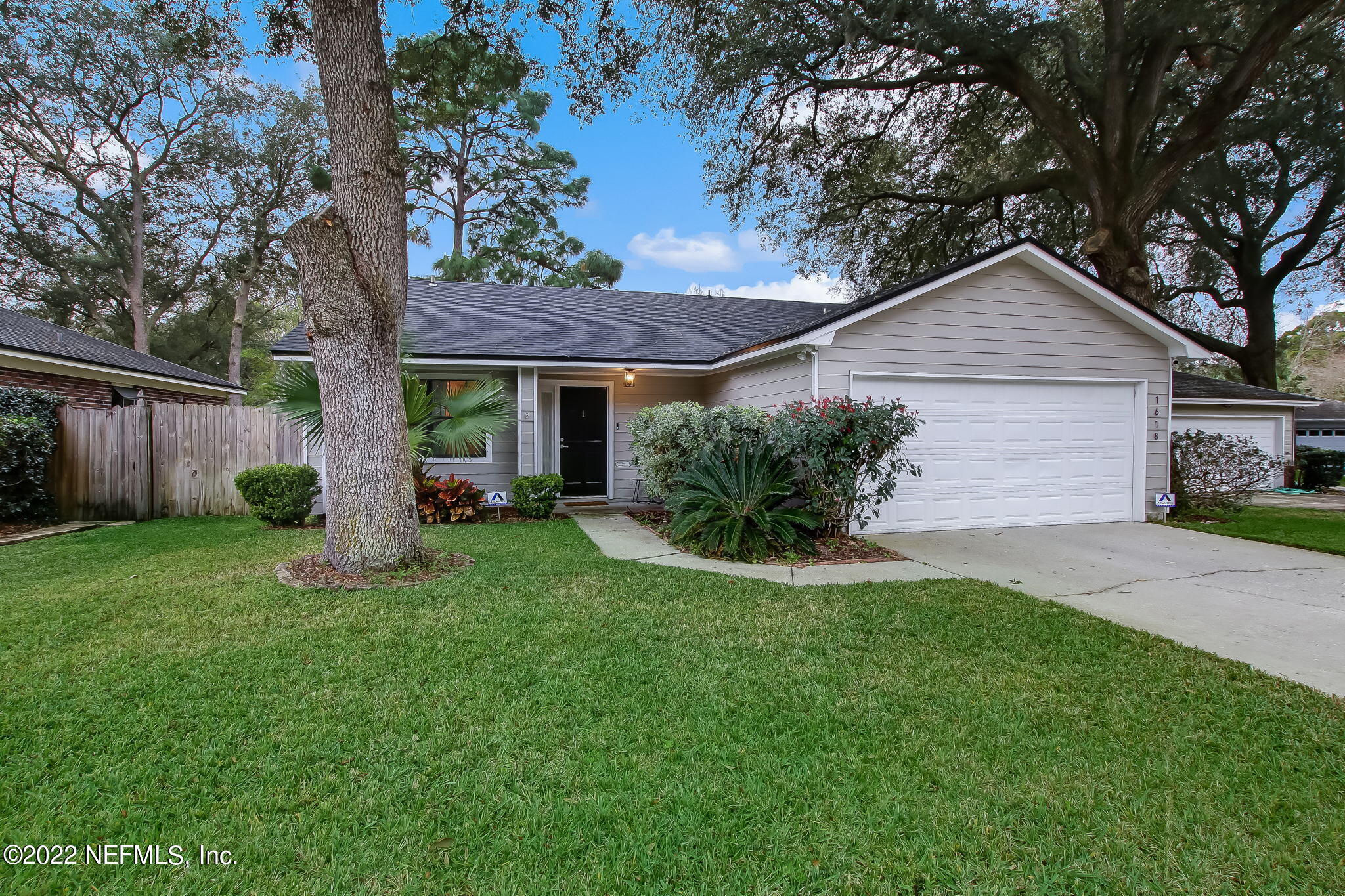 1618 Panther Ridge Court Jacksonville, FL 32225 - Photo 2 of 46 a front view of a house with a garden and yard