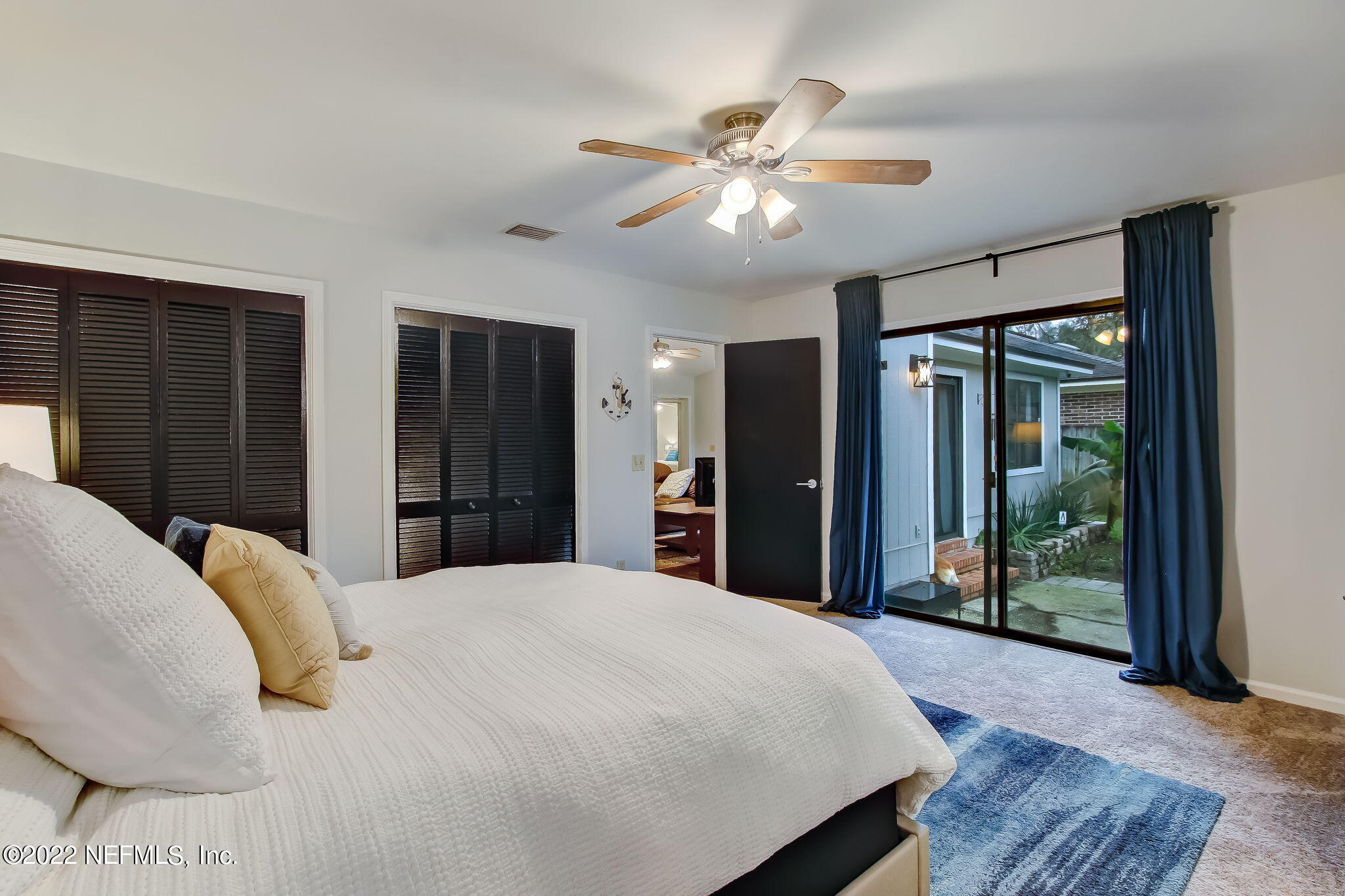 1618 Panther Ridge Court Jacksonville, FL 32225 - Photo 26 of 46 a bedroom with a large bed and a chandelier