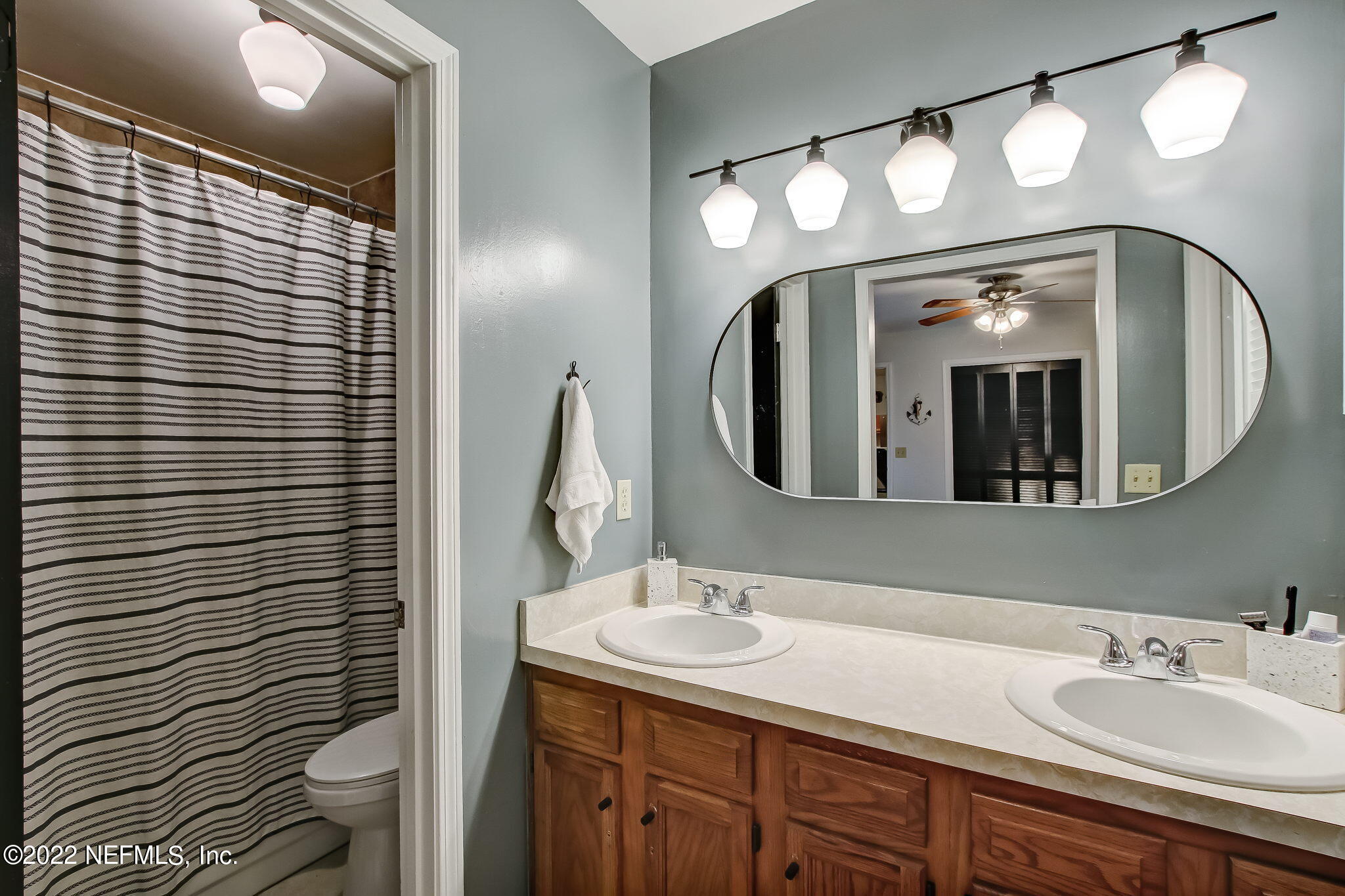 1618 Panther Ridge Court Jacksonville, FL 32225 - Photo 28 of 46 a bathroom with a sink and a mirror