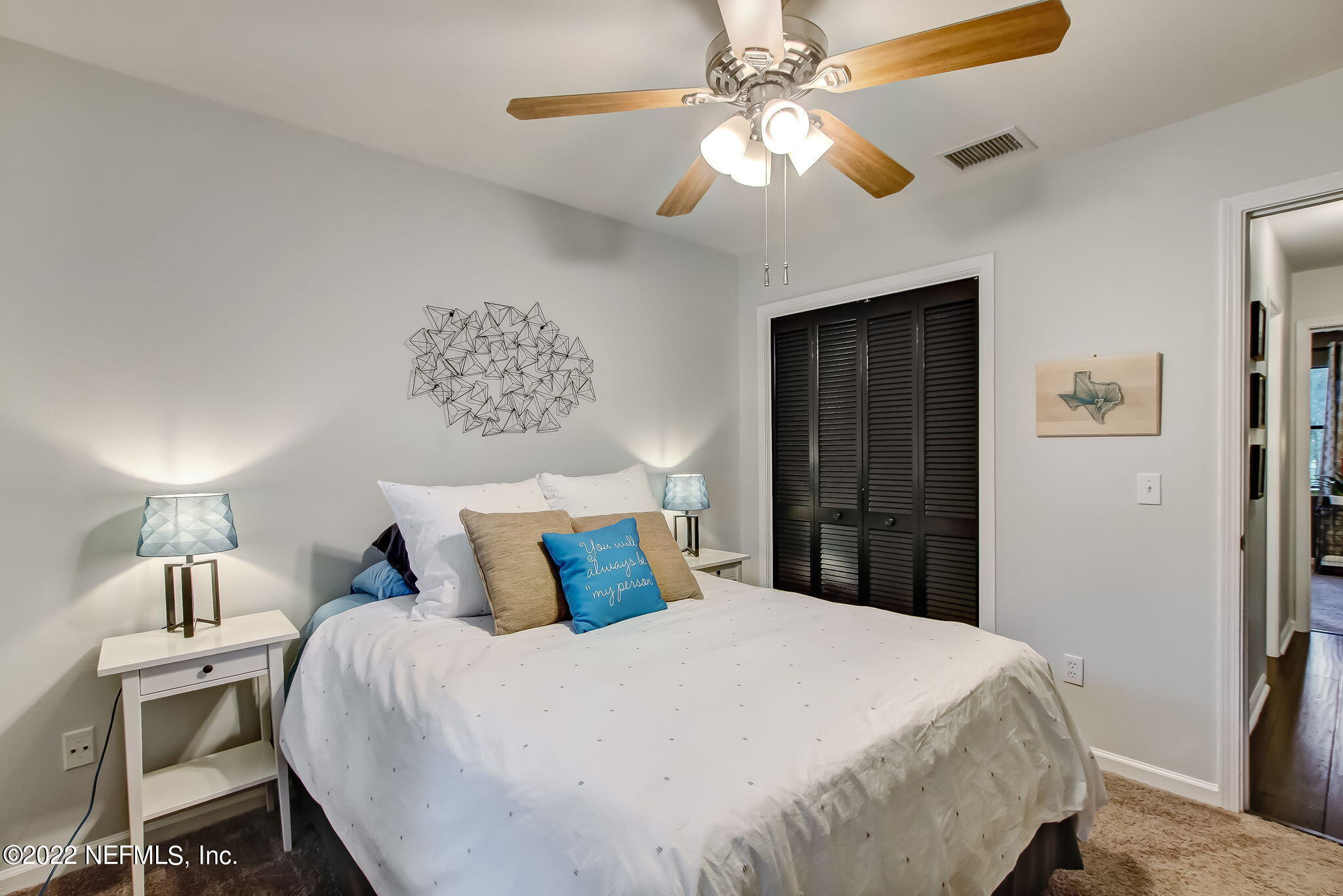 1618 Panther Ridge Court Jacksonville, FL 32225 - Photo 30 of 46 a bedroom with a bed and a chandelier