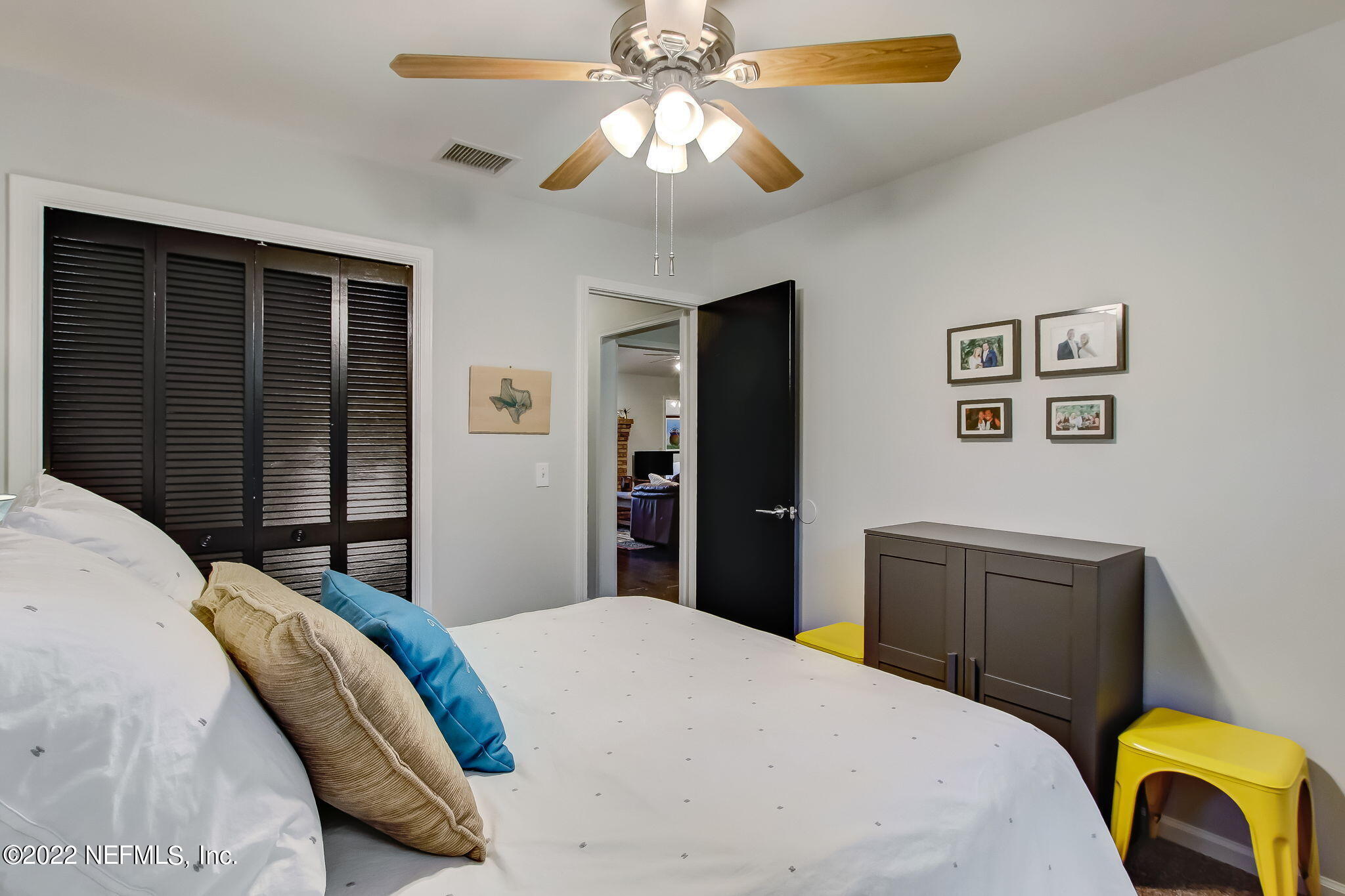 1618 Panther Ridge Court Jacksonville, FL 32225 - Photo 31 of 46 a bedroom with a bed and a chandelier