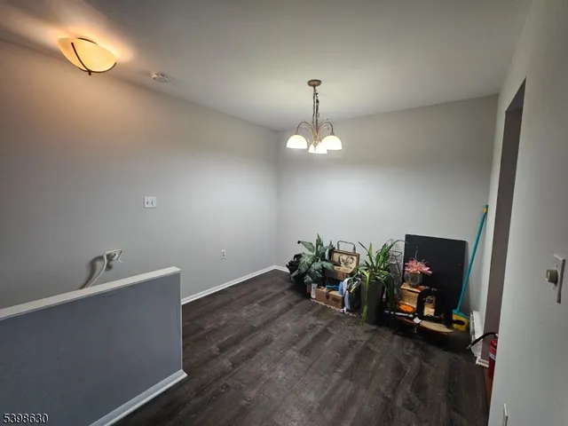 a view of a room with wooden floor and couch