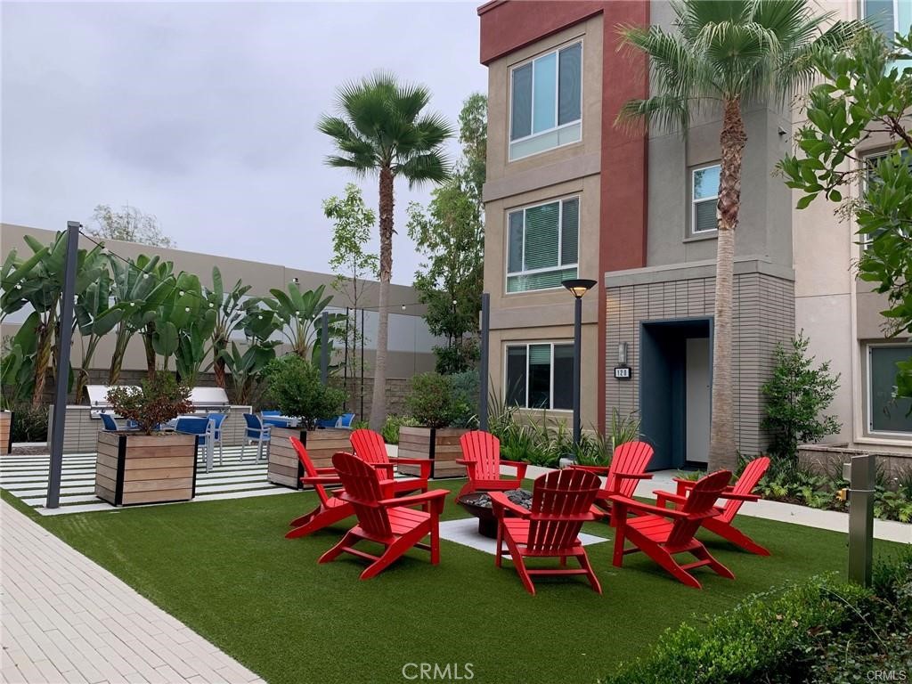 120 Citysquare Irvine, CA 92614 - Photo 1 of 13 a view of a house with backyard sitting area and garden