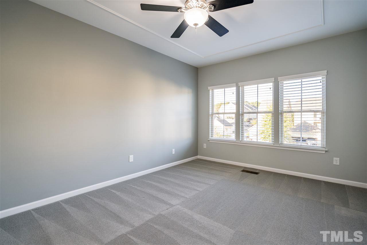 1521 Rodessa Run Raleigh, NC 27607 - Photo 20 of 29 Owner's bedroom features a huge walk in closet, en suite bathroom and tons of natural light.