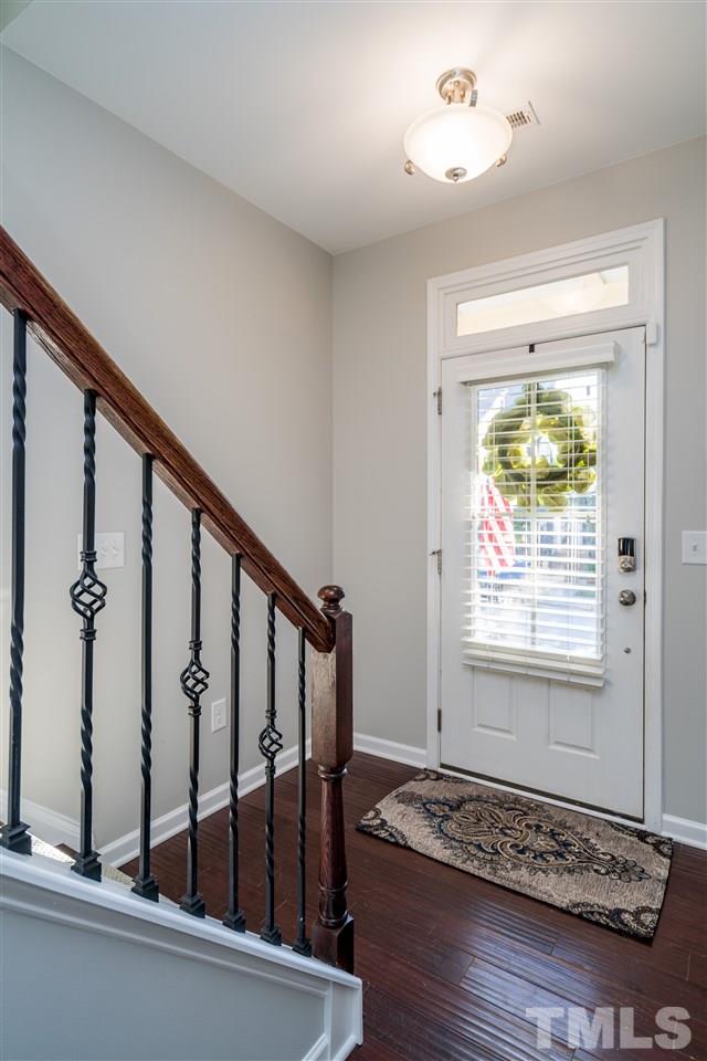 1521 Rodessa Run Raleigh, NC 27607 - Photo 3 of 29 Lovely, light-filled foyer greets you on the first level of this three story townhome.