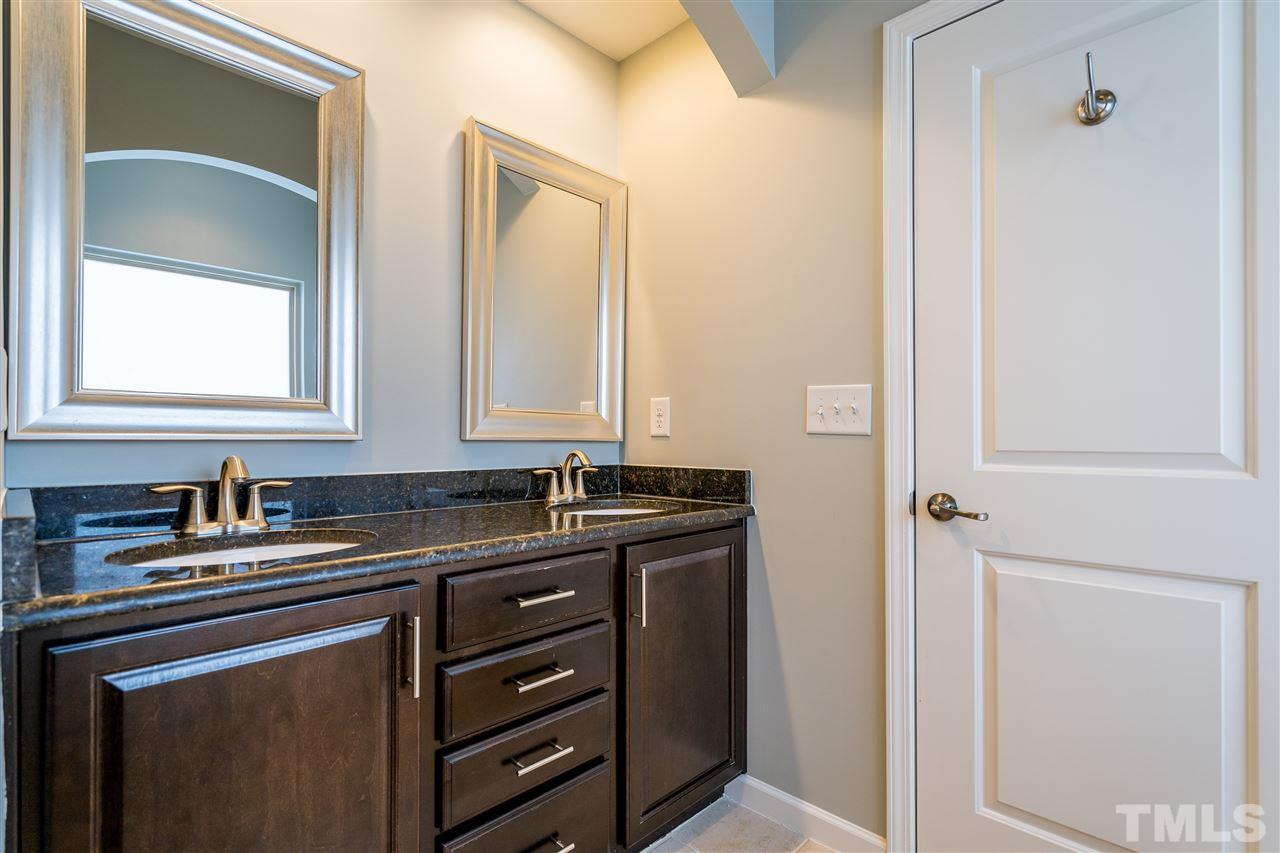 1521 Rodessa Run Raleigh, NC 27607 - Photo 23 of 29 Double sinks, granite counters, ceramic tile, garden tub, separate shower, this bathroom has it all!