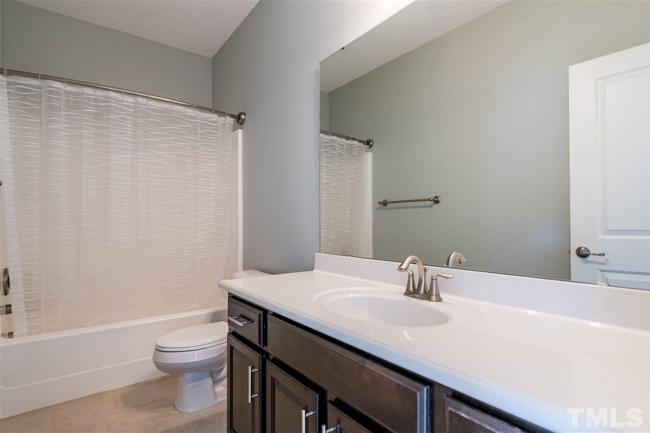 1521 Rodessa Run Raleigh, NC 27607 - Photo 26 of 29 Third floor full hallway bathroom shared by two secondary bedrooms.