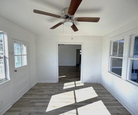 363 Southeast Allen Place Lake City, FL 32025 - Photo 11 of 14 a view of an empty room with a window and wooden floor
