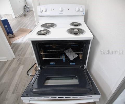 363 Southeast Allen Place Lake City, FL 32025 - Photo 13 of 14 a stove top oven sitting inside of a kitchen