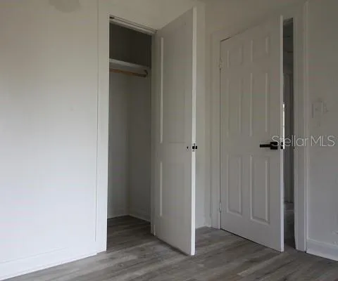 an empty room with wooden floor