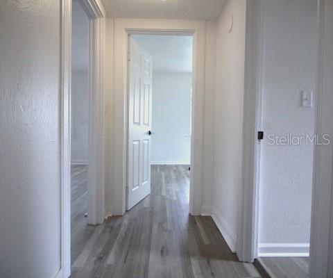 363 Southeast Allen Place Lake City, FL 32025 - Photo 10 of 14 a view of a hallway with wooden floor