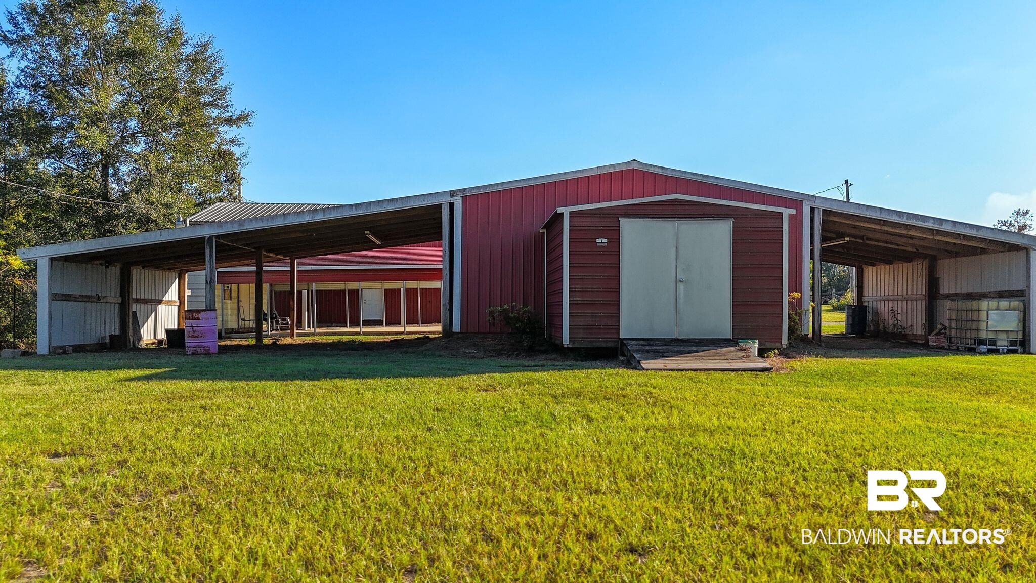 888 Mobile Cut-Off Road St. Stephens, AL 36569 - Photo 35 of 54 View of pole building featuring a lawn