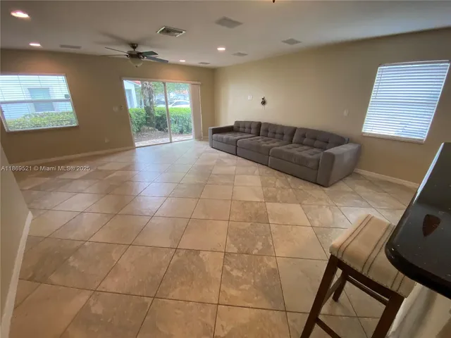 a view of a kitchen with a sink and cabinets
