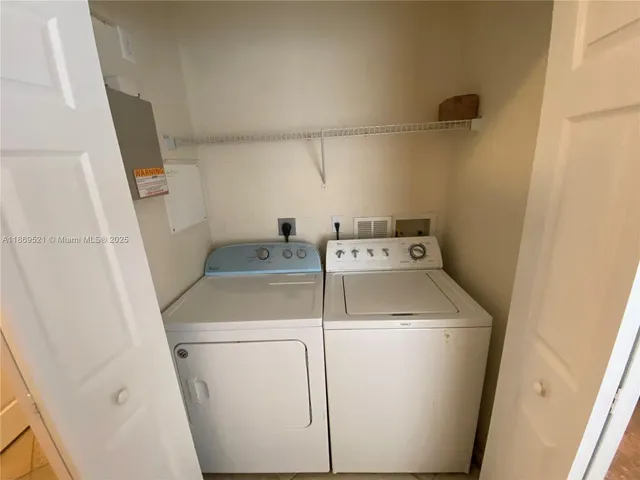 a bathroom with a glass door shower