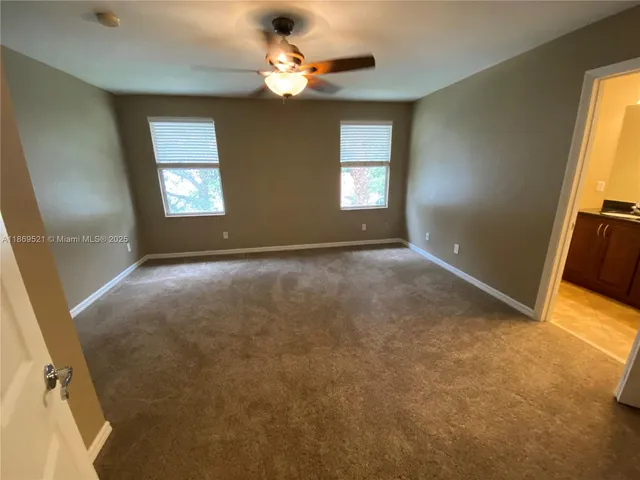 a en suite bathroom with a sink and mirror