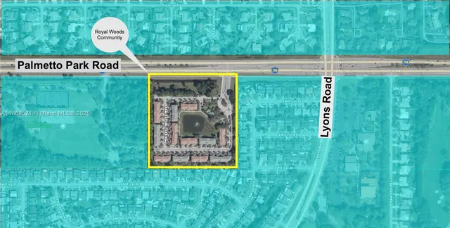 an aerial view of a house with a garden and lake view