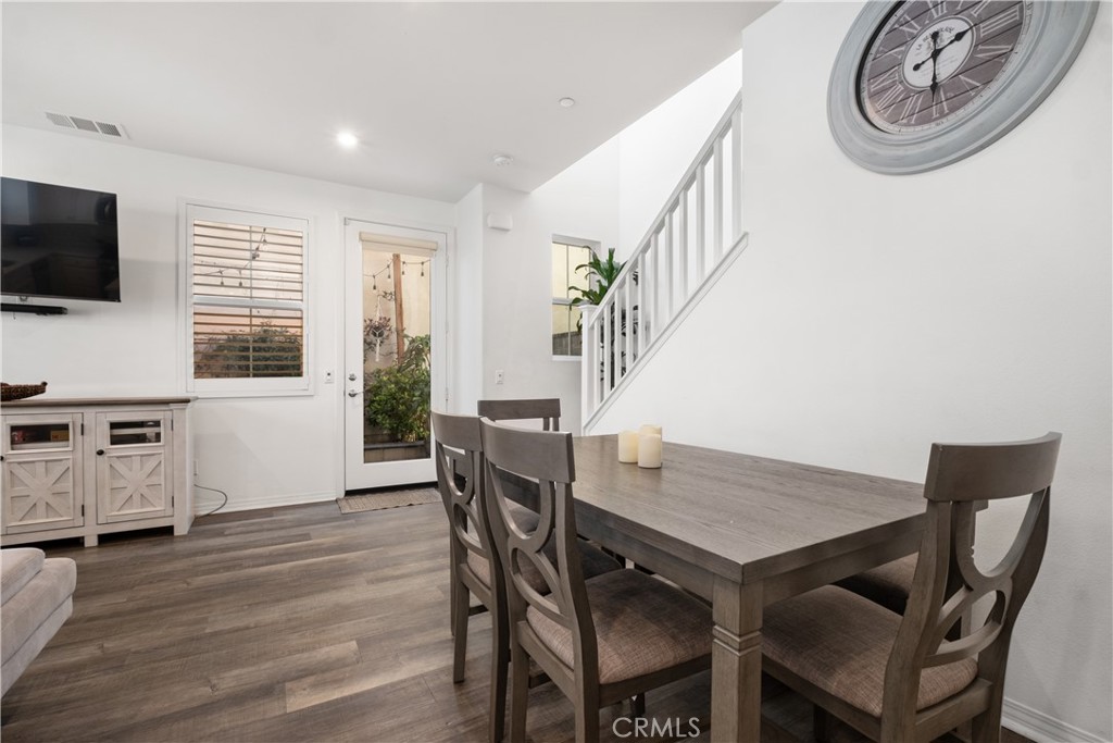 166 Natal Road Rancho Mission Viejo, CA 92694 - Photo 12 of 56 a view of a dining room with furniture window and wooden floor