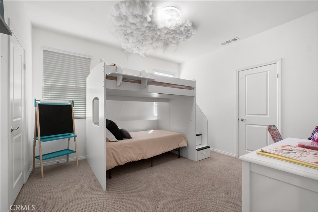 166 Natal Road Rancho Mission Viejo, CA 92694 - Photo 18 of 56 a bedroom with a bed and a fireplace