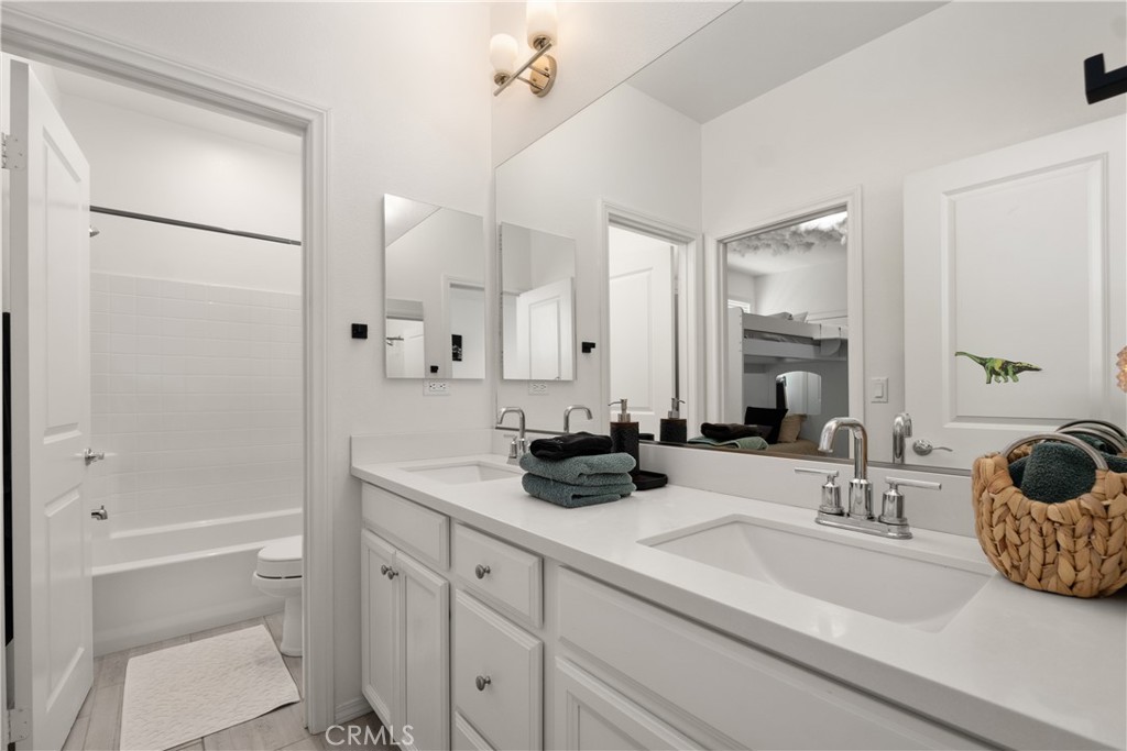 166 Natal Road Rancho Mission Viejo, CA 92694 - Photo 19 of 56 a bathroom with a double vanity sink mirror double and shower