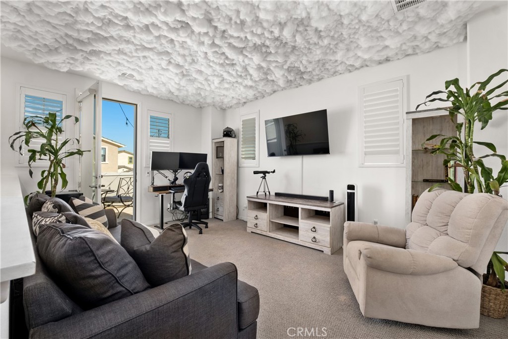 166 Natal Road Rancho Mission Viejo, CA 92694 - Photo 20 of 56 a living room with furniture and a flat screen tv