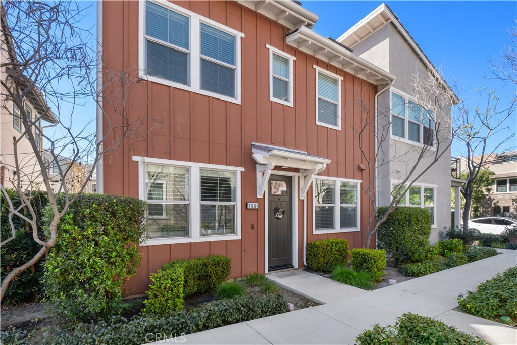 166 Natal Road Rancho Mission Viejo, CA 92694 - Photo 30 of 56 a front view of a house with garden and porch