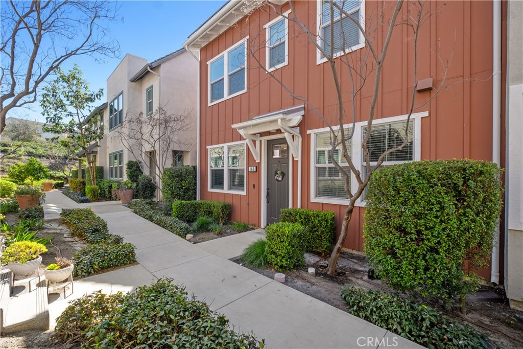 166 Natal Road Rancho Mission Viejo, CA 92694 - Photo 31 of 56 a front view of a house with garden