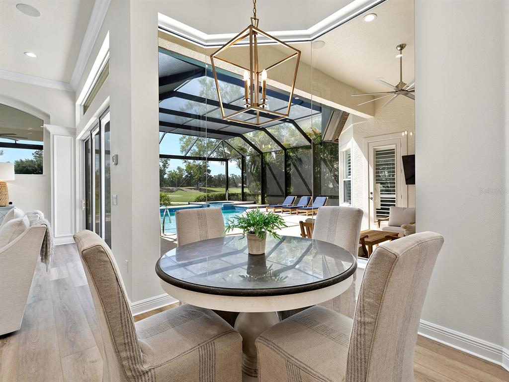 7431 Greystone Street Lakewood Ranch, FL 34202 - Photo 29 of 85 a view of a dining room with furniture window and outside view