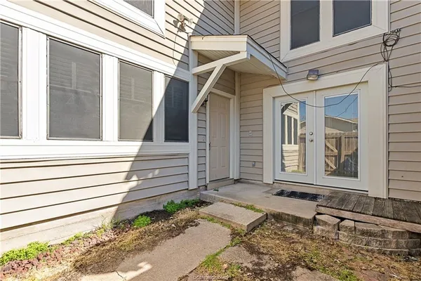a front view of a house with a wooden floor and a window