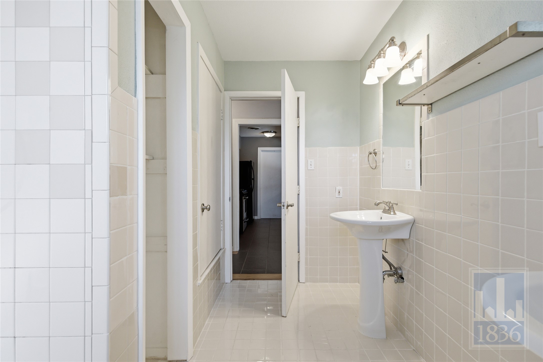 2416 South 5th Street, Unit B Austin, TX 78704 - Photo 14 of 28 a bathroom with a sink a toilet and shower