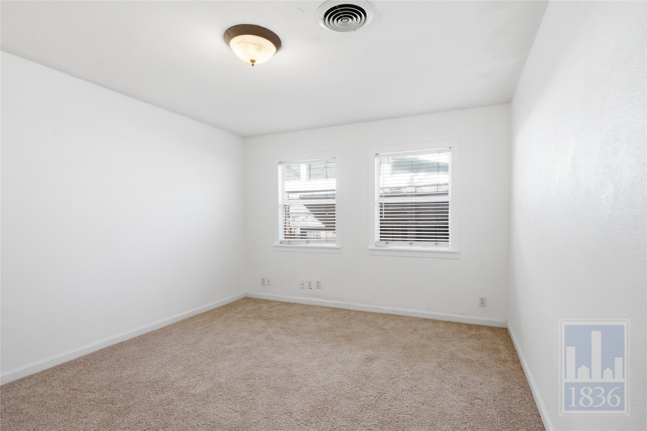 2416 South 5th Street, Unit B Austin, TX 78704 - Photo 16 of 28 an empty room with windows