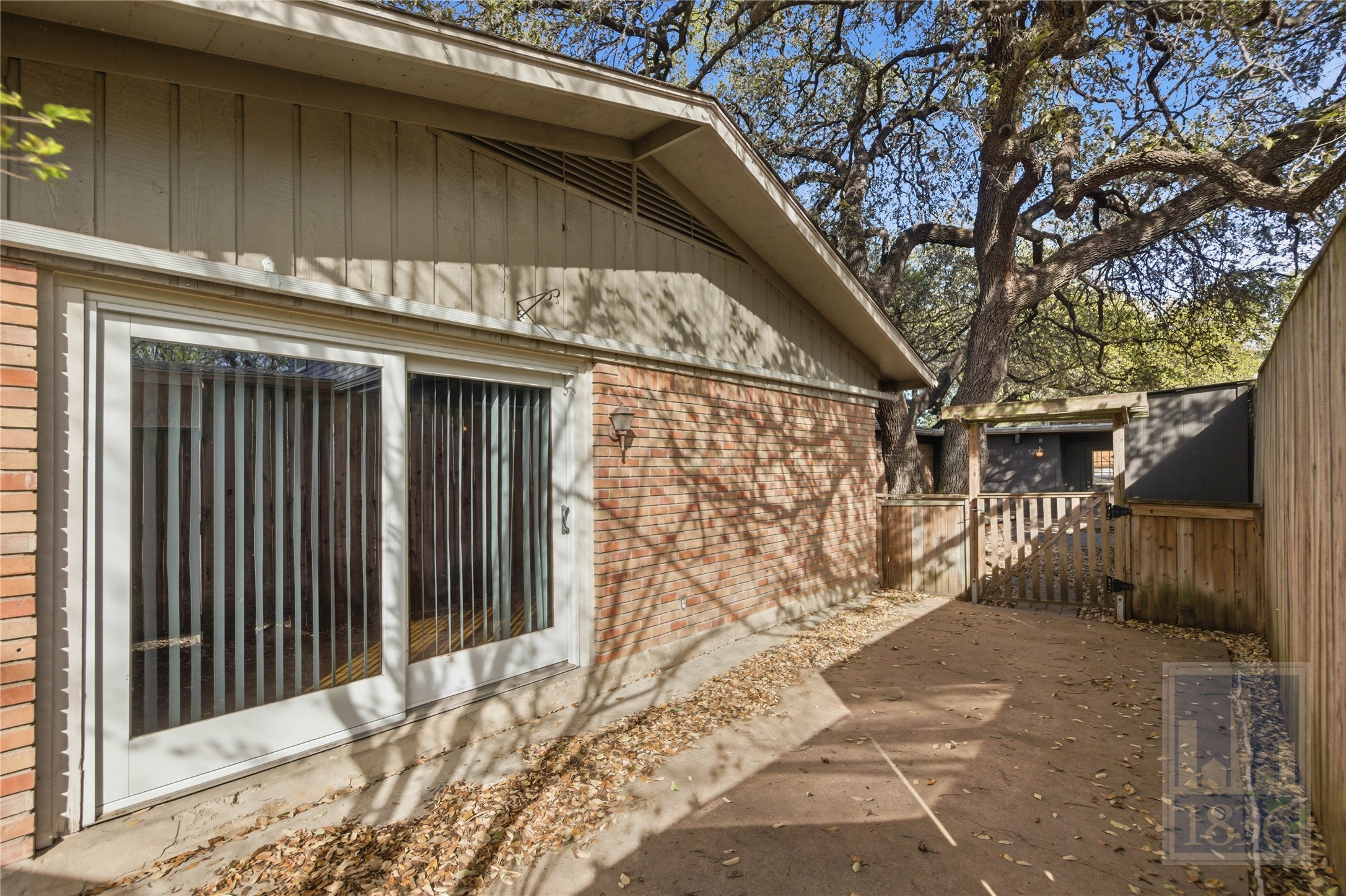 2416 South 5th Street, Unit B Austin, TX 78704 - Photo 17 of 28 a side view of a house with a large tree