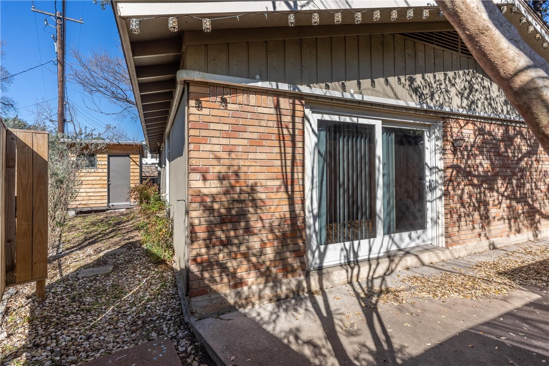 2416 South 5th Street, Unit B Austin, TX 78704 - Photo 19 of 28 a view of a house with a door and wooden walls