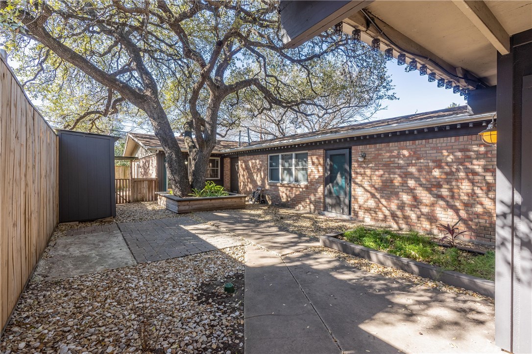 2416 South 5th Street, Unit B Austin, TX 78704 - Photo 25 of 28 a view of a house with a tree in the background