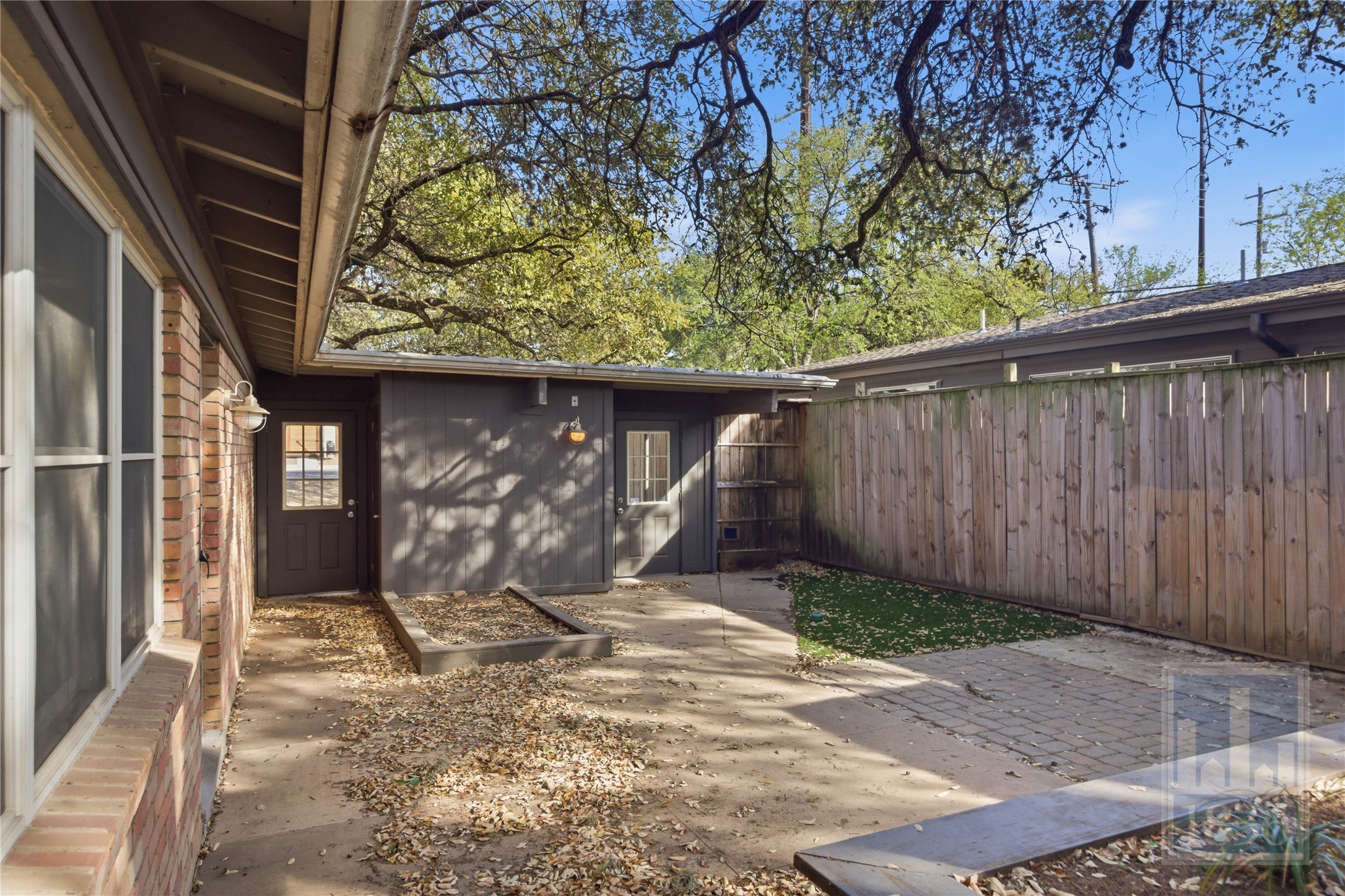 2416 South 5th Street, Unit B Austin, TX 78704 - Photo 28 of 28 a view of a house with a tree in the background