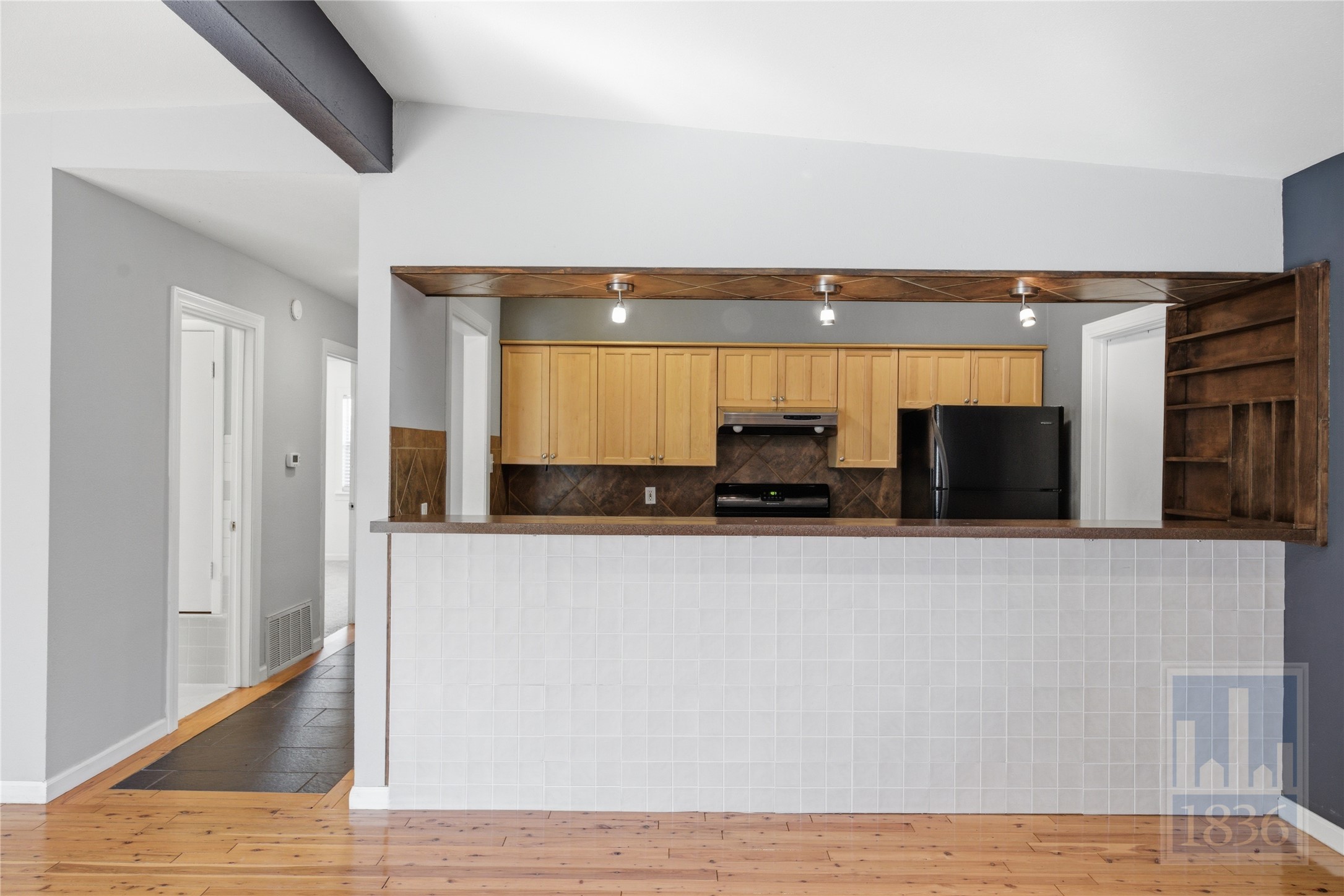2416 South 5th Street, Unit B Austin, TX 78704 - Photo 5 of 28 a view of kitchen with stainless steel appliances wooden floor and chair