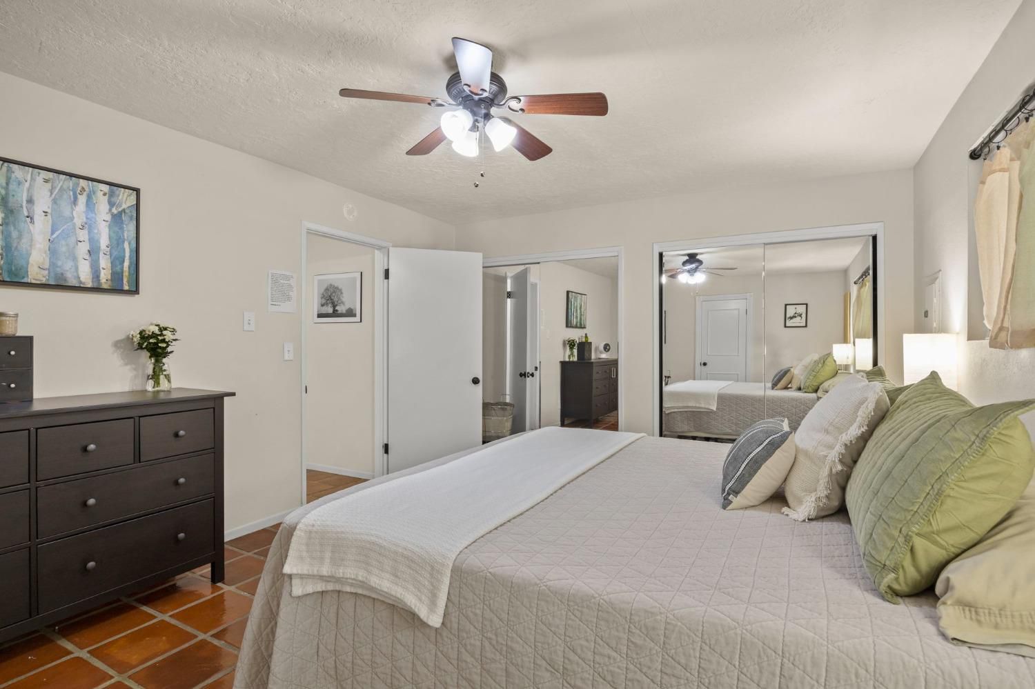 80 High Street Oak View, CA 93022 - Photo 12 of 93 a bedroom with a bed and a chandelier