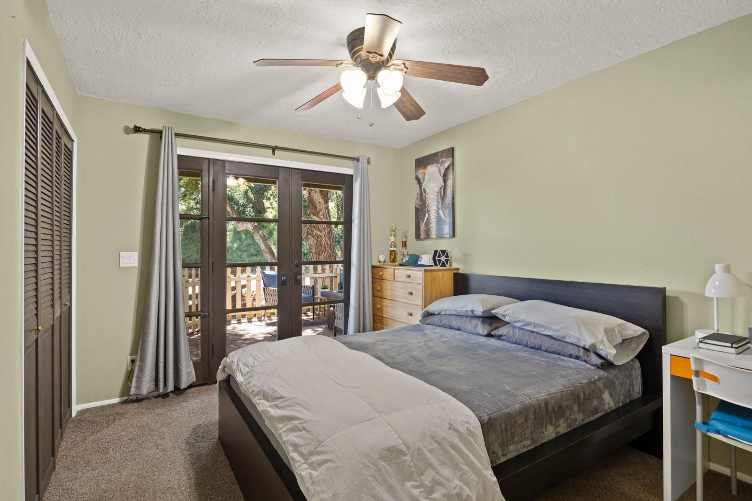 80 High Street Oak View, CA 93022 - Photo 16 of 93 a bedroom with a large bed and a chandelier