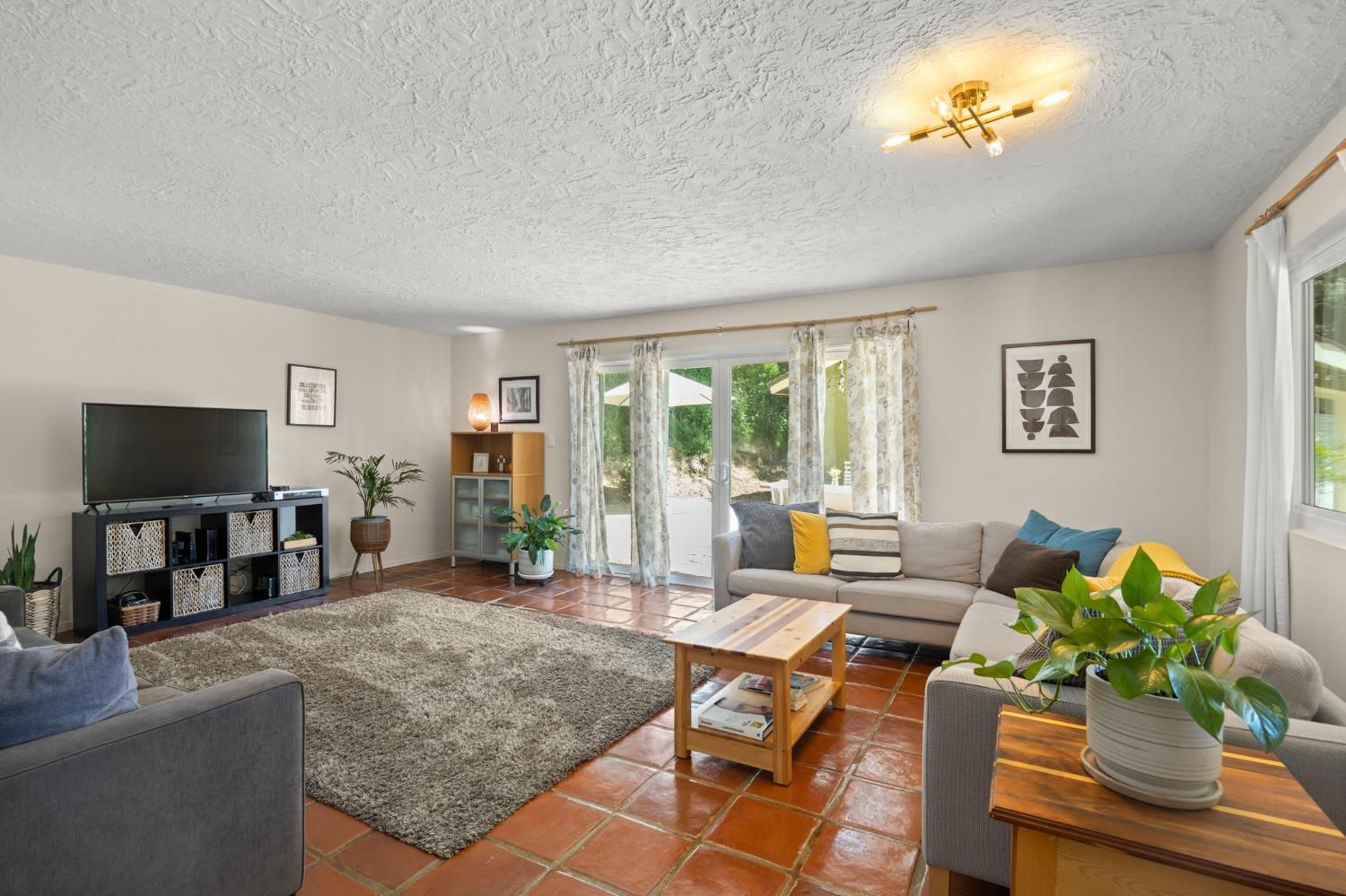 80 High Street Oak View, CA 93022 - Photo 25 of 93 a living room with furniture a flat screen tv and a floor to ceiling window