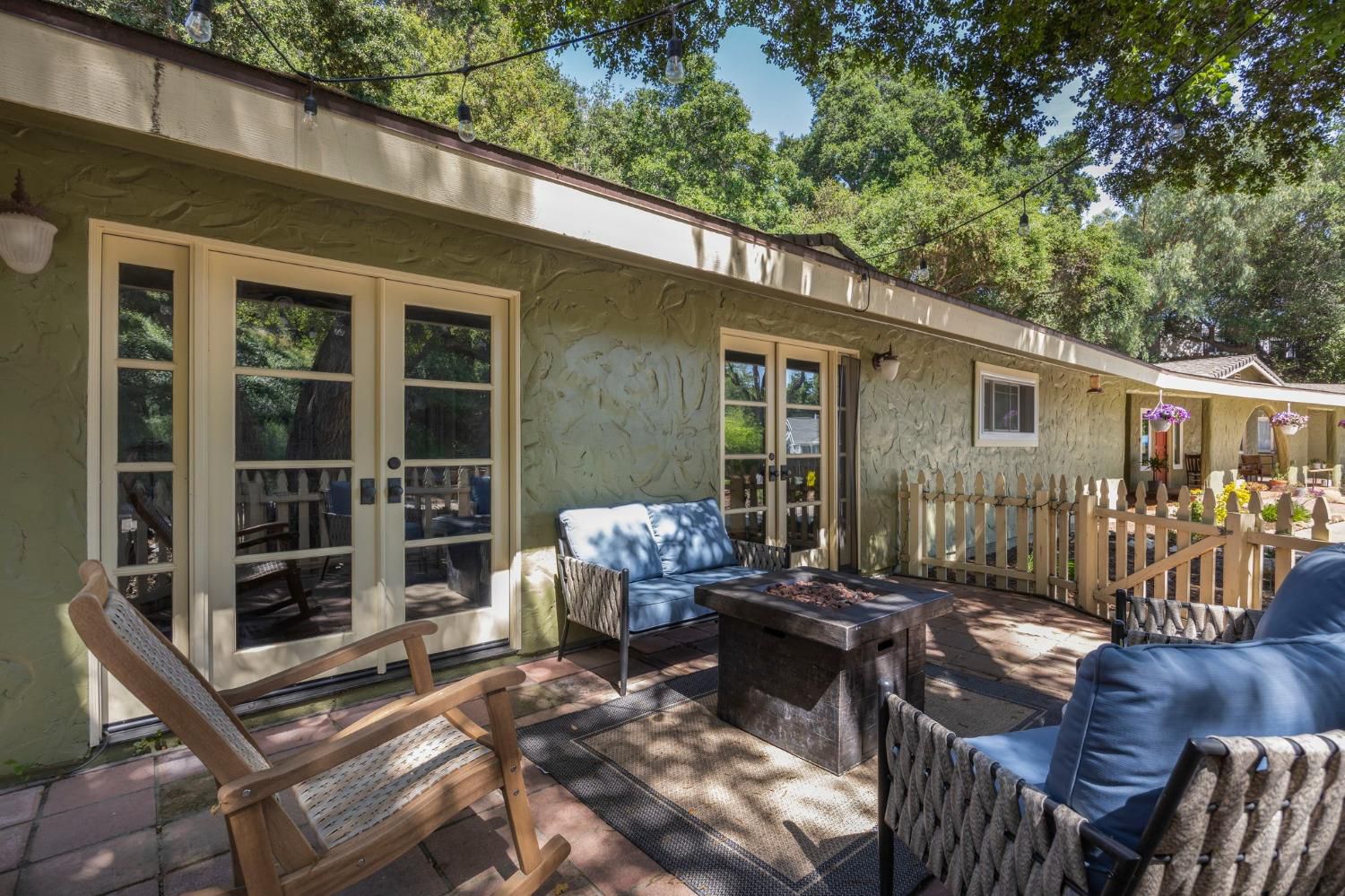 80 High Street Oak View, CA 93022 - Photo 37 of 93 a view of a patio with table and chairs and wooden fence