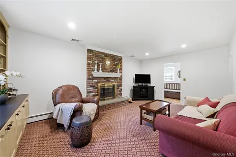 a living room with furniture fireplace and a flat screen tv