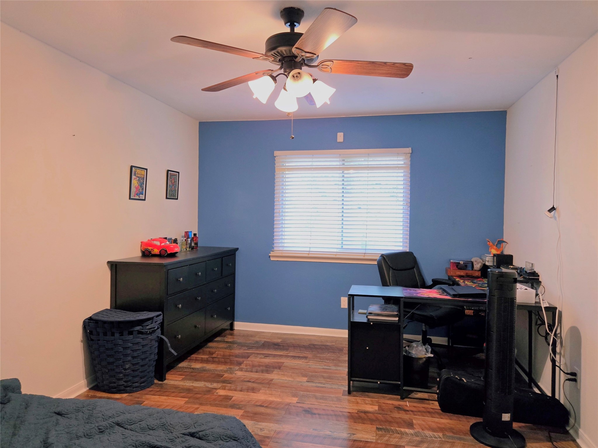 9211 Memorial Grove Drive Spring, TX 77379 - Photo 30 of 38 a bedroom with a bed and a chandelier