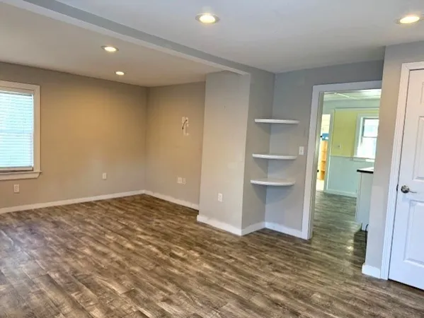 a view of an empty room and window
