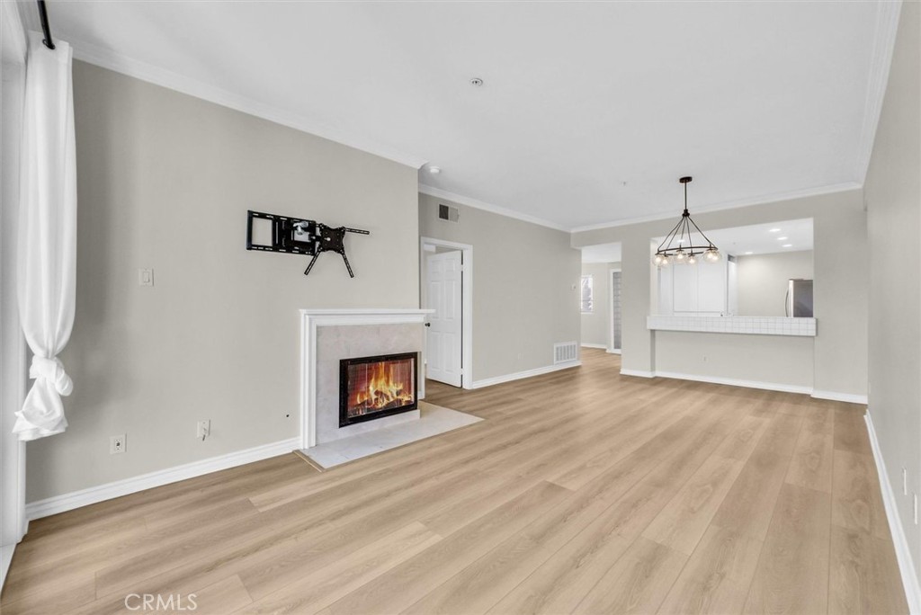 2243 Martin Irvine, CA 92612 - Photo 11 of 36 a view of an empty room with a fireplace and a window