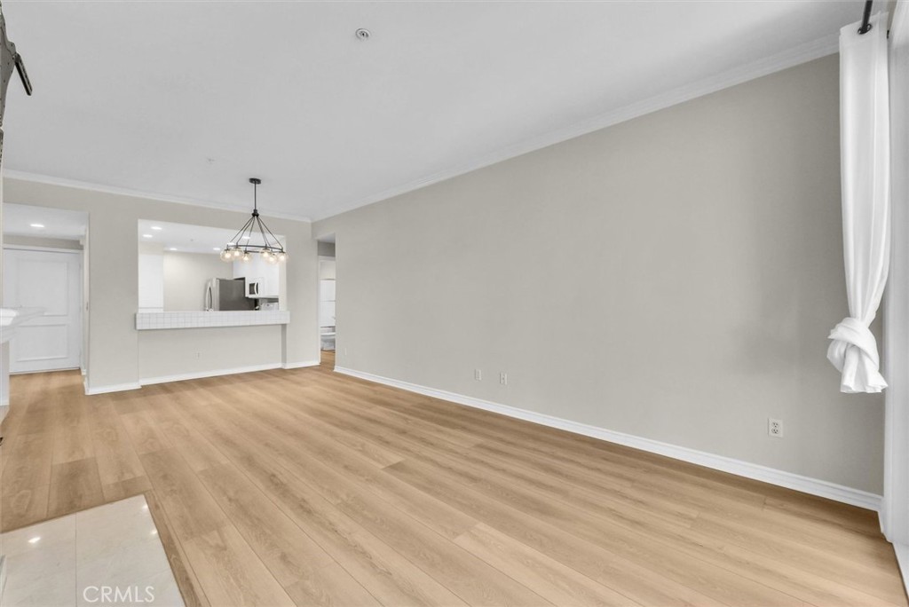 2243 Martin Irvine, CA 92612 - Photo 13 of 36 wooden floor in an empty room with a kitchen