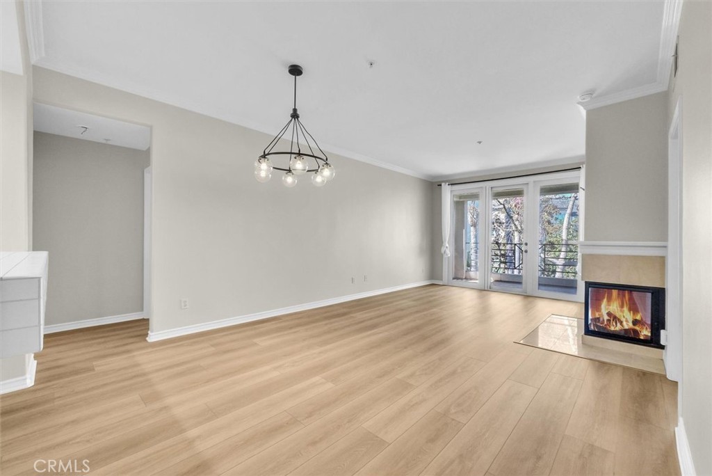 2243 Martin Irvine, CA 92612 - Photo 14 of 36 a view of an empty room with wooden floor fireplace and a window