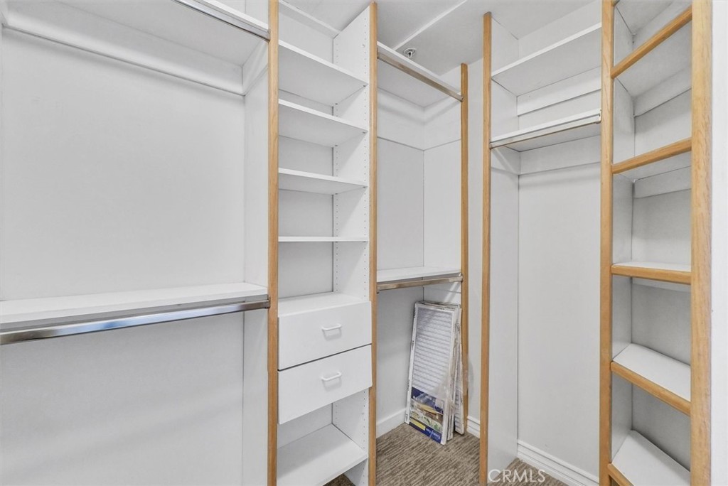 2243 Martin Irvine, CA 92612 - Photo 19 of 36 a view of walk in closet with empty racks
