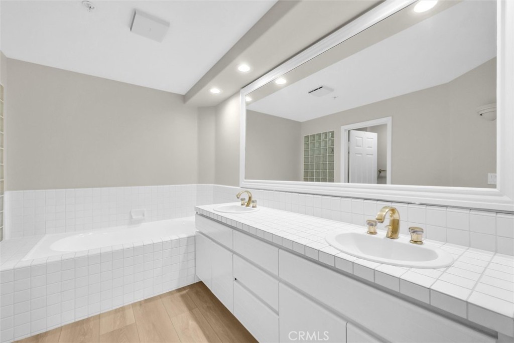 2243 Martin Irvine, CA 92612 - Photo 30 of 36 a bathroom with a tub sink and mirror