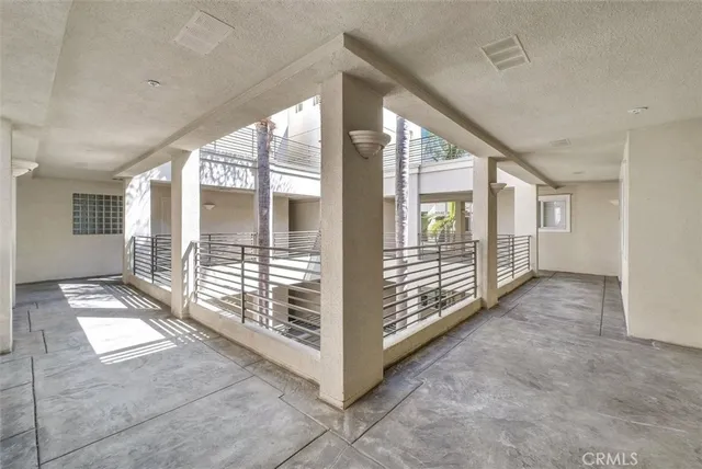 a view of a hallway with windows